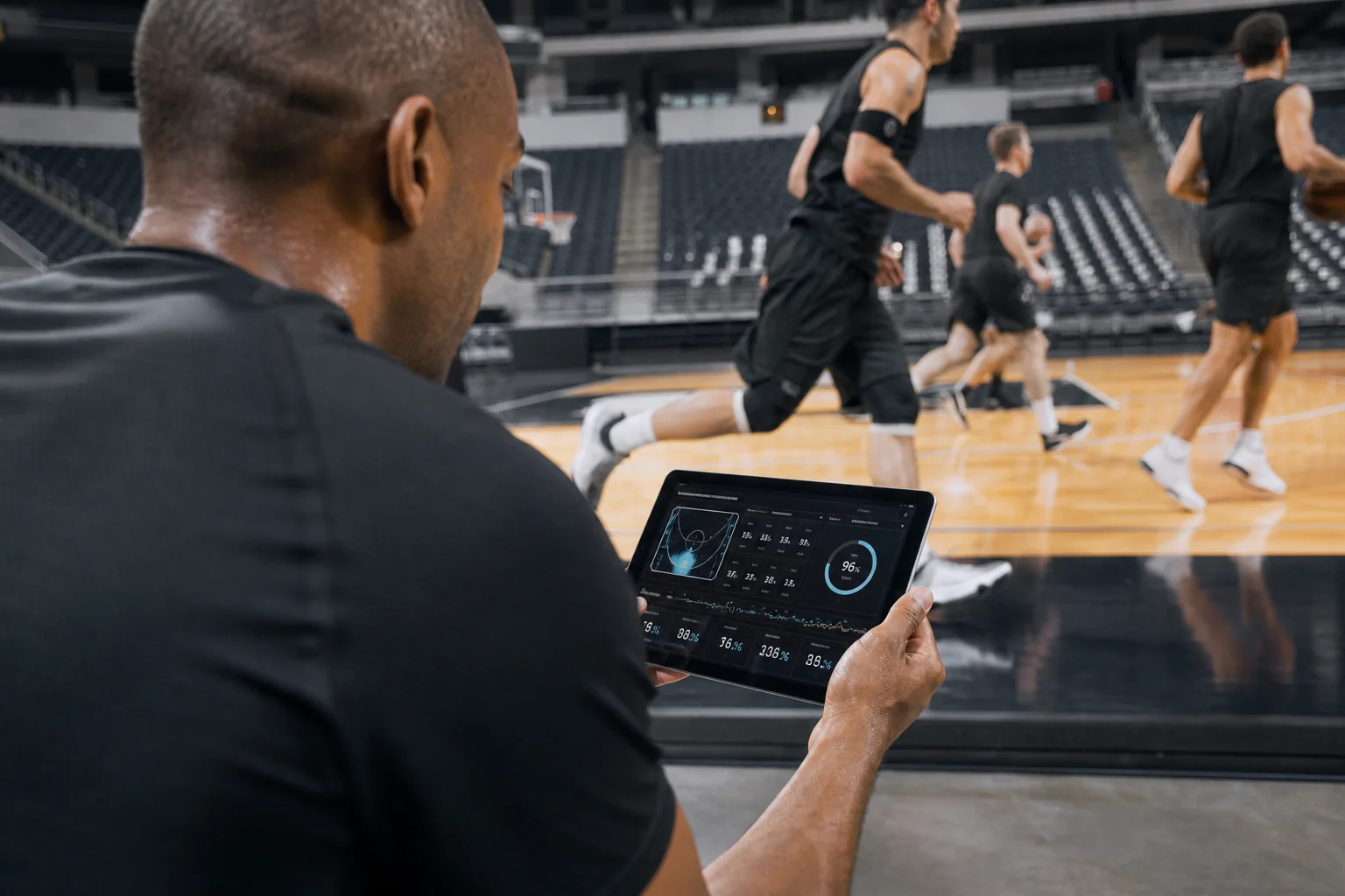 Connected sports wearables or sensor-equipped balls being used by athletes during an identifiable training drill, with usage metrics visible