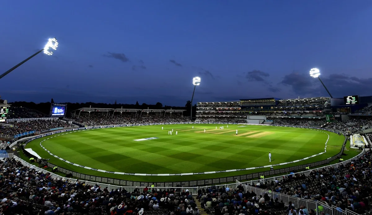 Modern floodlit sports stadium with a clearly visible playing field and seating bowl